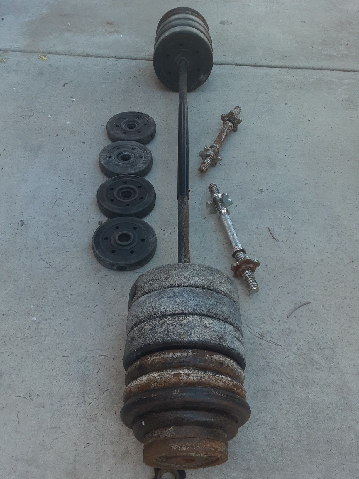 One Barbell bar , Two Dumbbells & 135 lb Weight adjustable Disck