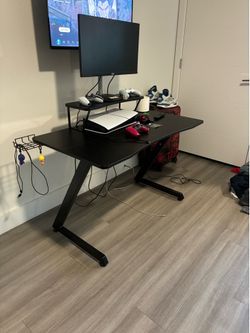 Black gaming desk with LED lights