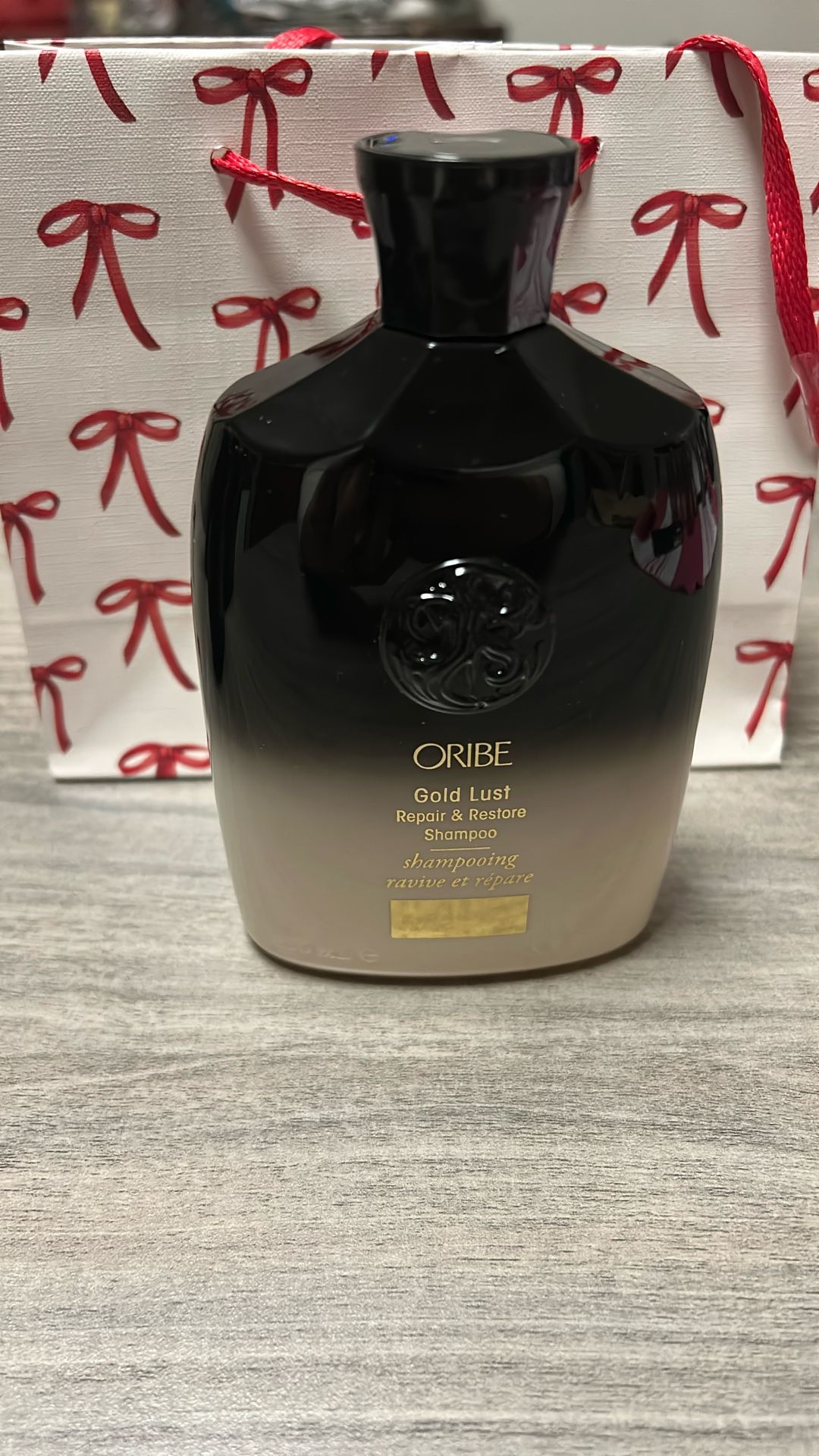 Oribe Gold Lust Repair & Restore Shampoo. 