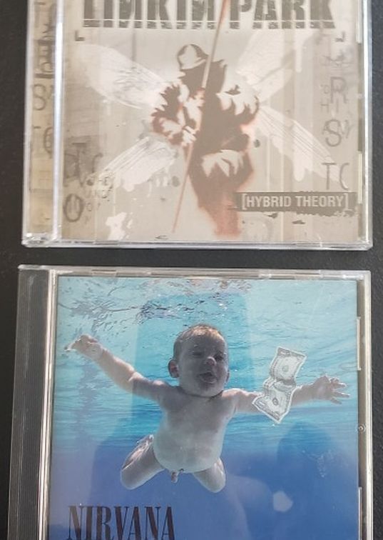 Nirvana: Nevermind and Linkin Park: Hybrid Theory CDs