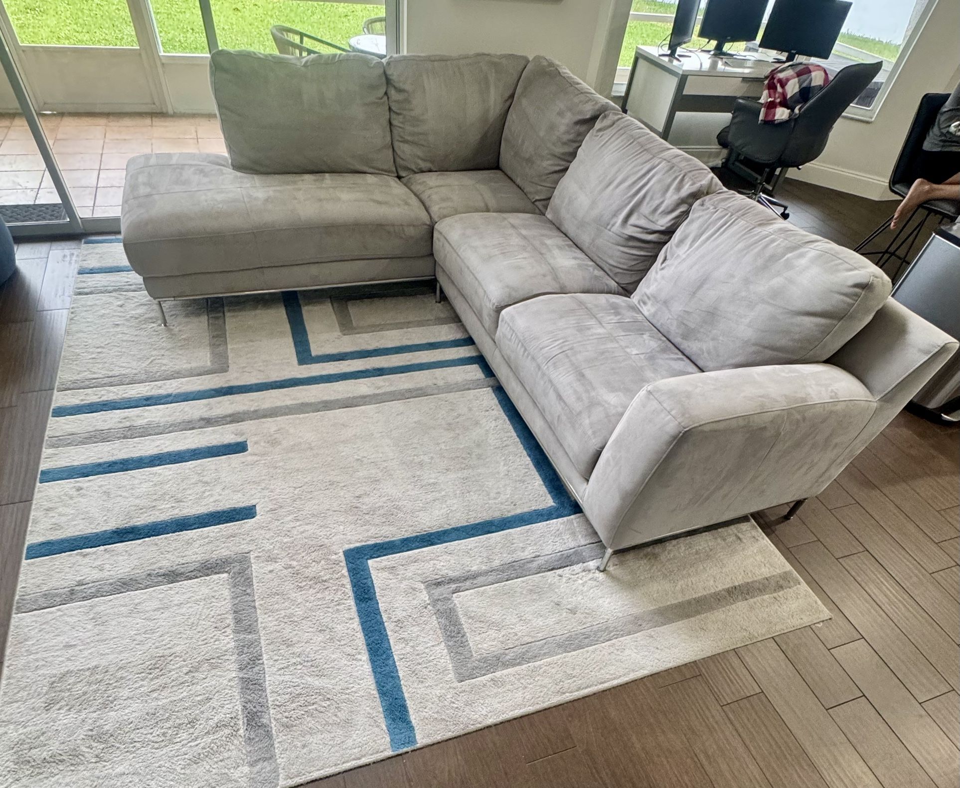L-shape couch and area rug. Left chaise facing. Couch is 108 inches wide and 90 inches in length.