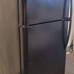 Black fridge in like new condition with warranty 