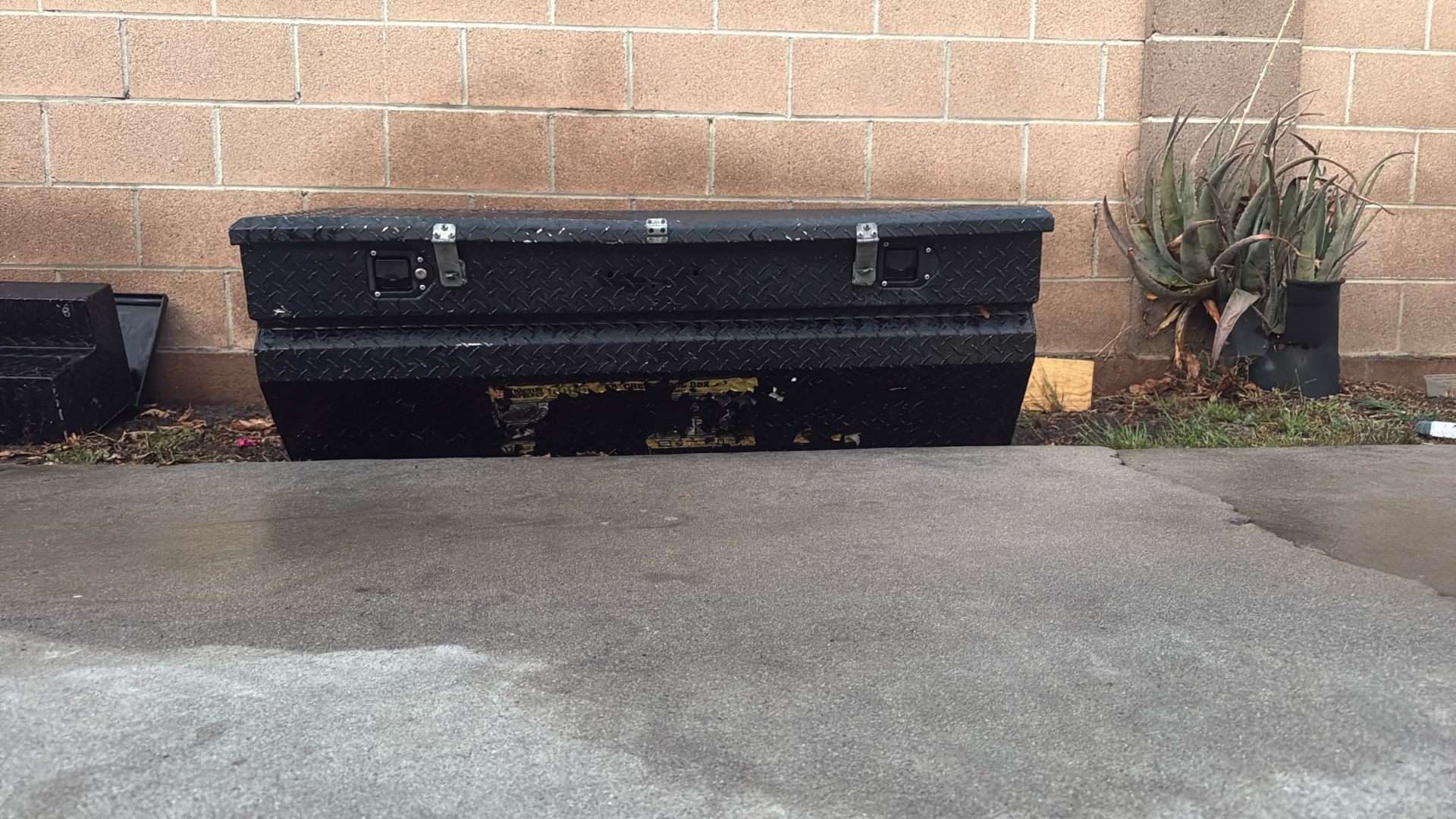 A Black Husky Aluminum Tool Box
