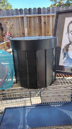 Small black portable camping toilet ,folds too