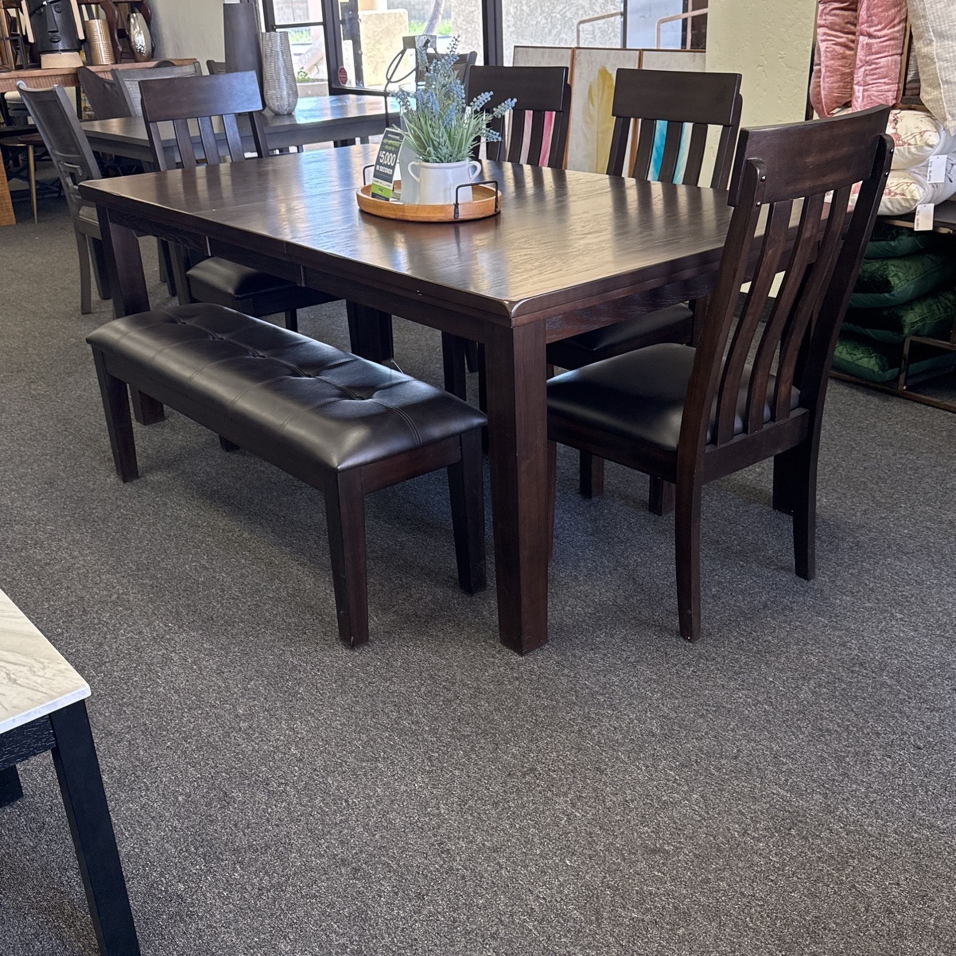 Dining Set With Butterfly Leaf With 4 Chairs And A Bench By Ashley furniture