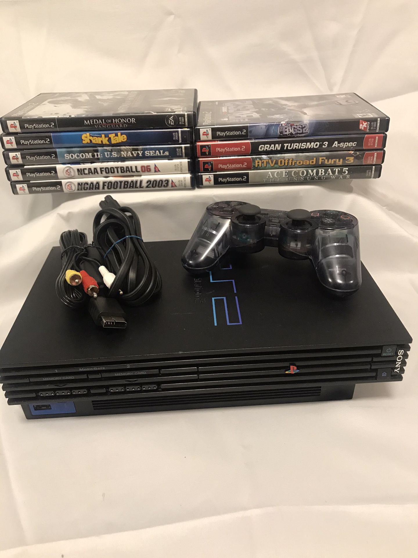 PlayStation 2 Console with 9 games and a remote