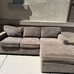 Couches with a bed on the bottom and storage for blanket