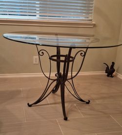 48"glass  beveled top rod iron dining table.