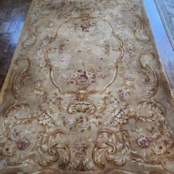 5.5 x 8.5 hand made very thick area rug. 