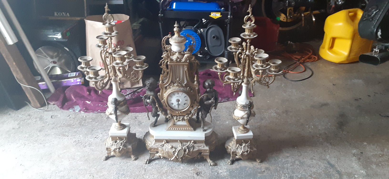 3 piece antique clock and candle holder set.