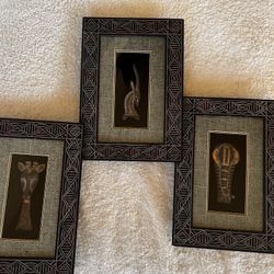  set of three dimensional (3D) decorative wall art pieces in an African / tribal-inspired style.