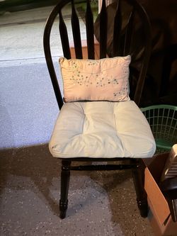 Matte black desk chair with cushions