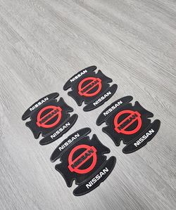 BRAND NEW UNIVERSAL 4PCS NISSAN RUBBER ANTI-SCRATCH DOOR HANDLE BOWL PROTECTOR