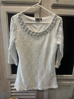 Dressy top for women a Lacey top over a solid bottom with sparkly ornaments around the neck side, large and very good shape