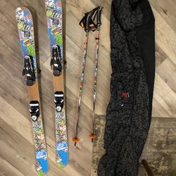 Line brand skis 142cm with poles and bag