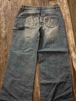 #juicycouture blue jeans rhinestone with the word juicy on the back