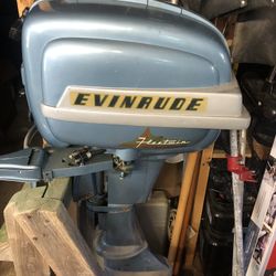 7 Hp Evinrude  with Tank cover and Stand .