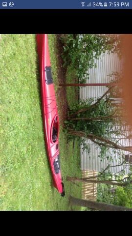 15’ sea kayak with rudder comes with paddle. Has storage compartments etc.