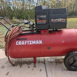 Craftsman 25-gallon air compressor — works great, holds pressure, ready to use.