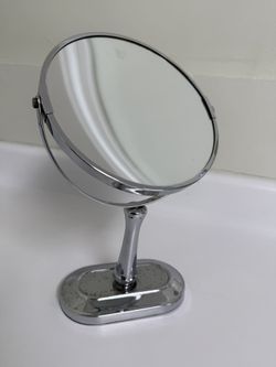 Tabletop vanity mirror with adjustable angle and close-up (magnified) view. 