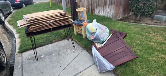 Desk, boxes, toddler bed, and outdoor kid toys