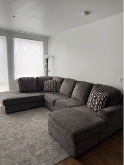 Great quality grey couch and matching rug for sale!