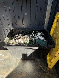 Large bin full of extension cords various sizes