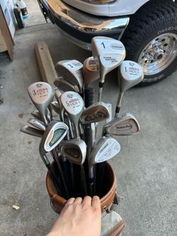 Left golf club set irons and wedges and a putter