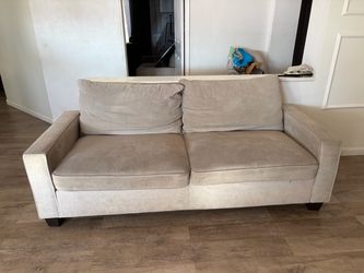 Beige Living spaces couch