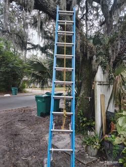 Sturdy blue extension ladder for outdoor use. Blue Keller Extension Ladder24” FiberglassTYPE2 Commercial 225lbsRating. Located Mount Dora Fla 32757.  