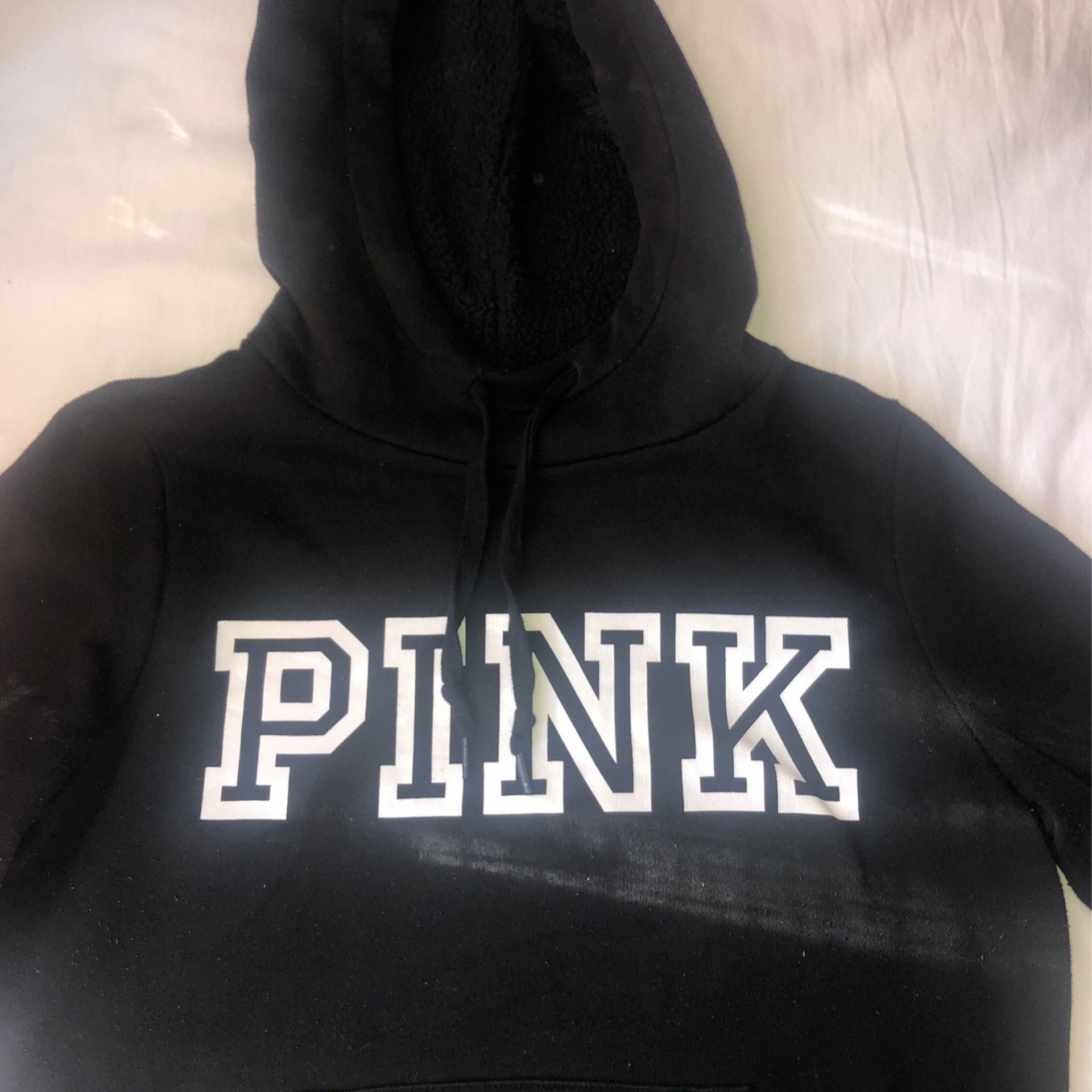 A black pink hoodie