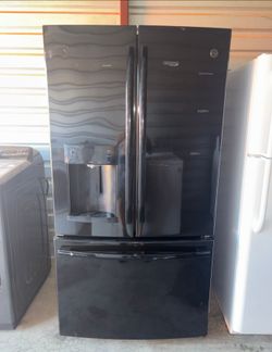 Black GE Refrigerator And Freezer