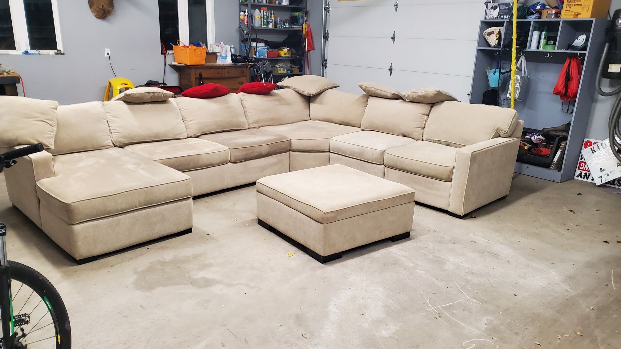 Tan Couch With Pillows And Foot Rest