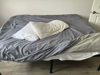Queen size black bed frame plus white queen mattress