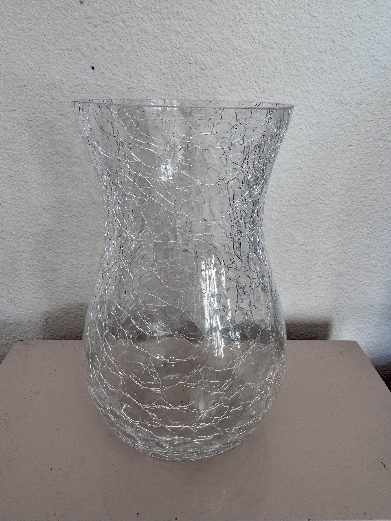 Flower vase looks cracked. Artistic. When sunlight hits it shows its beauty