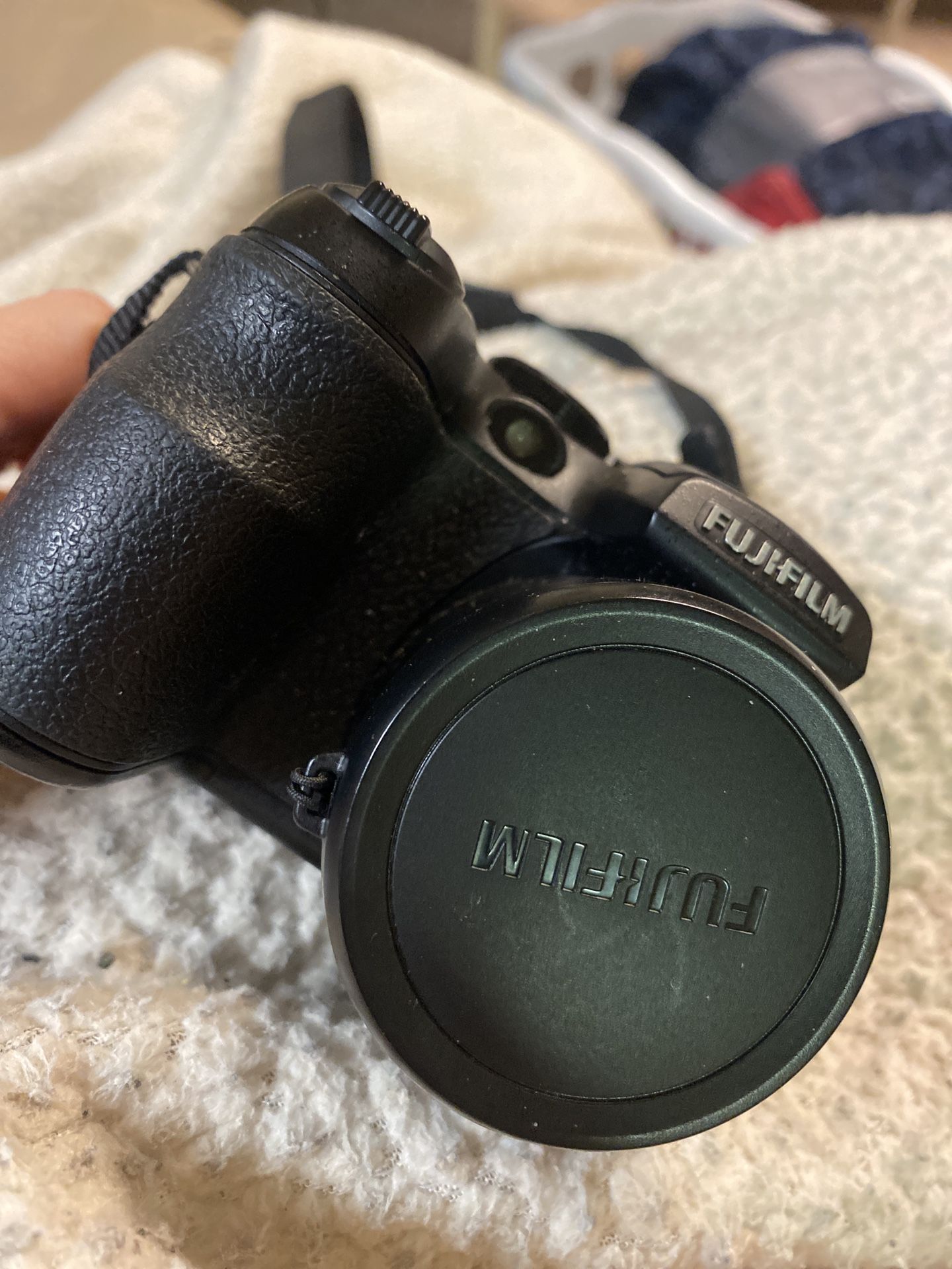 Fujifilm FinePix S1000fd 10MP Digital Camera – 12X Zoom + Strap & Lens Cap (Uses 4 AA Batteries)