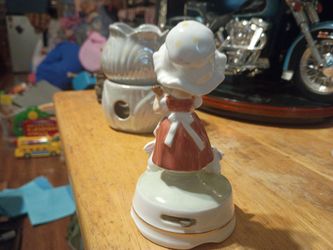 Vintage porcelain music box figurine