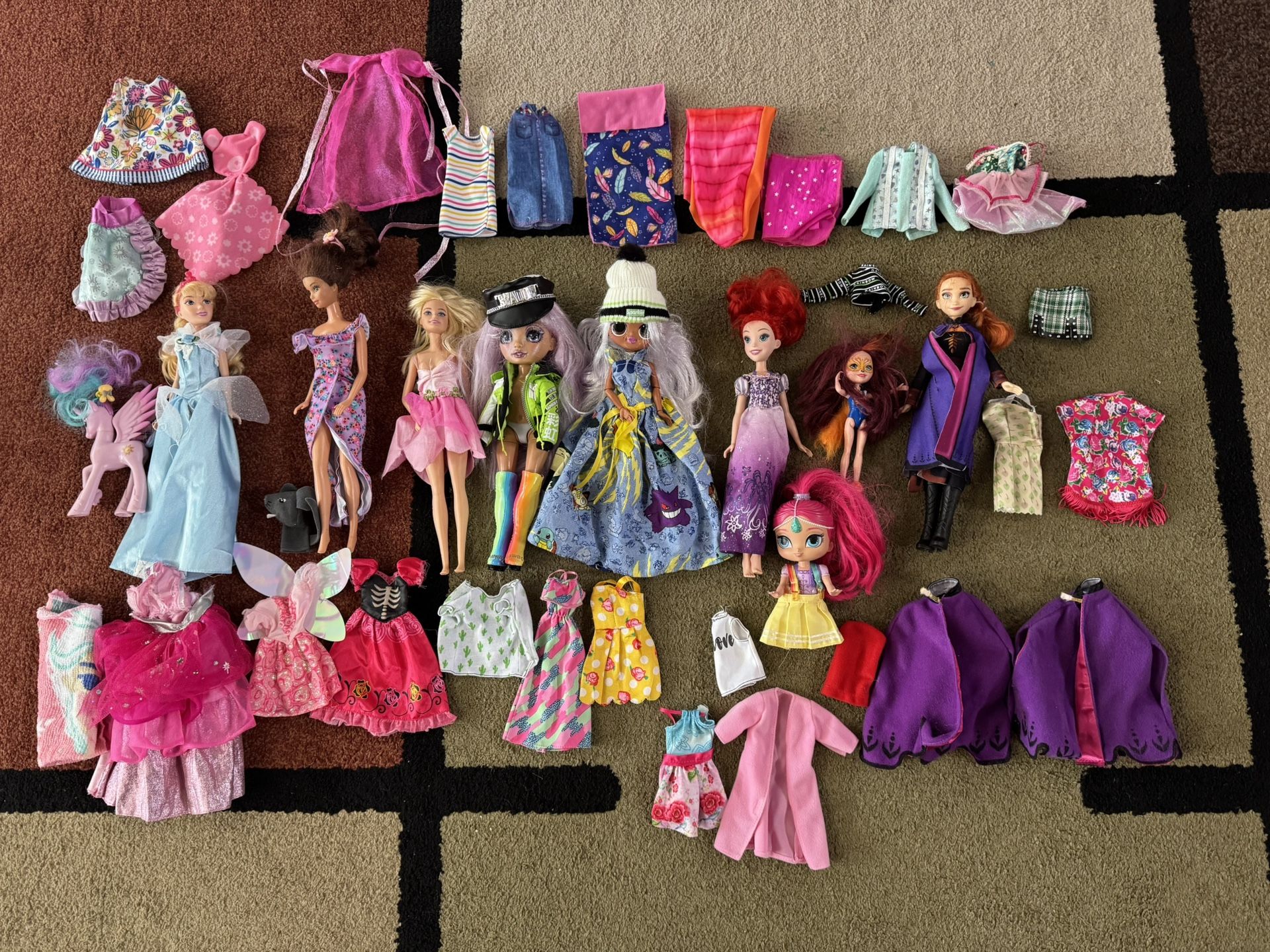 Assorted Dolls and Accessories! Collection of dolls with various outfits and accessories.