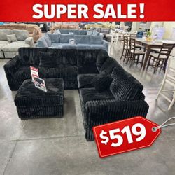 Black jumbo corduroy sectional sofa with ottoman 