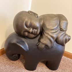 Heavy Sleeping Baby Monk On Top Of A Baby Elephant Statue