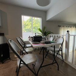 6 Folding Chairs And 1 Large Folding Table