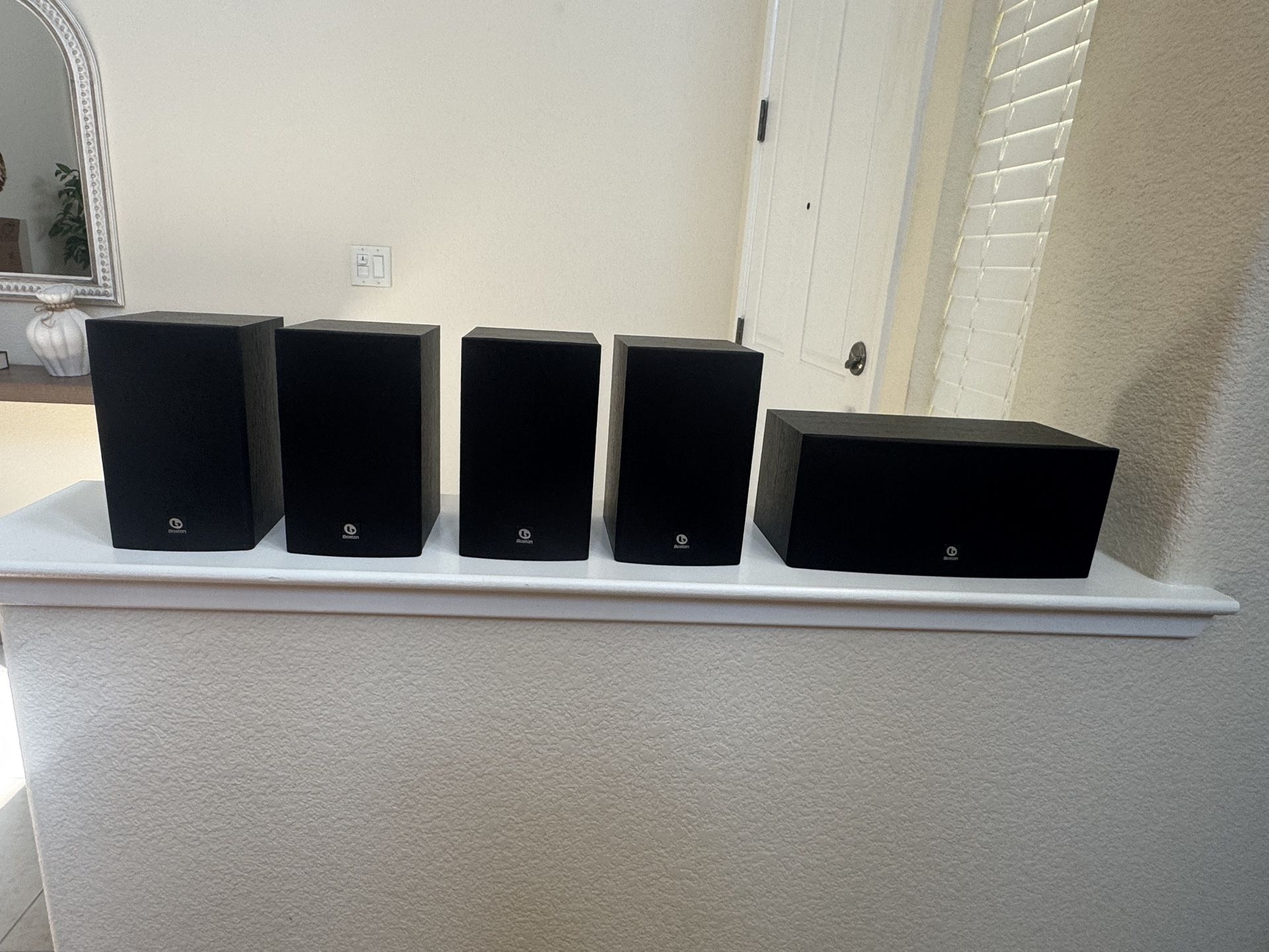 Surround sound system, pioneer receiver, sub, and 5 Boston acoustics speakers.