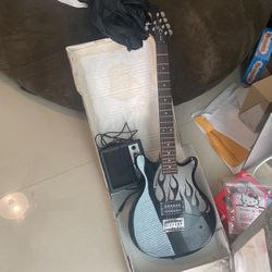 Electric guitar with amplifier and storage bag