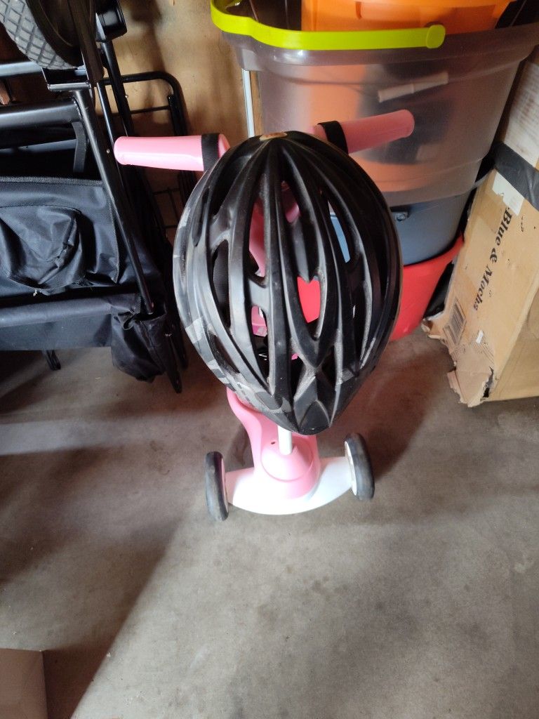 Helmet The Brand Is Bell The Pink Scooter Brand Is Radio Flyer