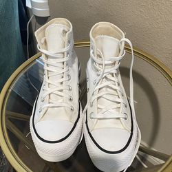 Converse Chuck Taylor All Star Lift high-top platform sneakers.