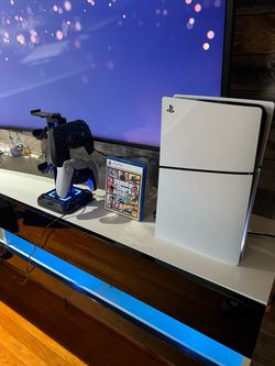 Play station 5 + 2 controllers + Controllers and headphone stand + GTA 5 game