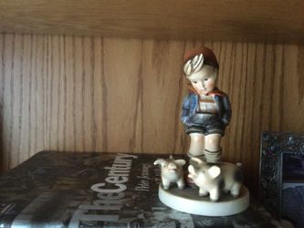 Hummel figure boy with piggies. One piggie has slightly chipped tail