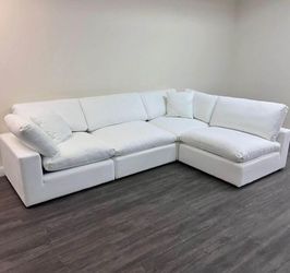 White Cloud couch sofa bed. Fully module and can be made into a bed. All covers come off for easy wash.