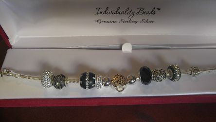Sterling Silver bracelet with 11 sterling charms