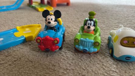 VTech Go! Go! Smart Wheels Airport Playset + 5 SmartPoint Vehicles,     Disney Mickey & Goofy vehicles included